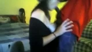 Она сосет весь его черный член целиком